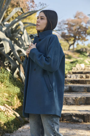 Picture of the "cocoon" coat in teal blue