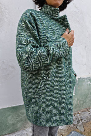 Picture of the "cocoon" coat in green herringbone