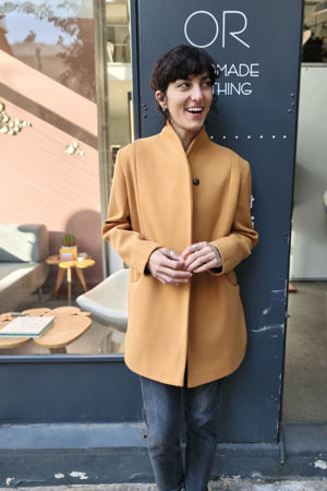 Picture of "curves" coat in pale mustard